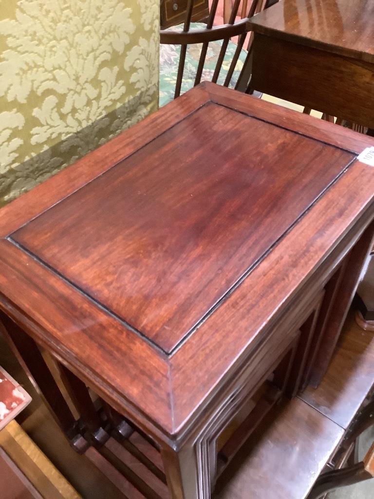 A Chinese nest of hardwood quartetto tables, largest 50cm